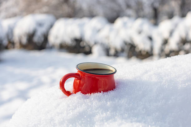 istock Coffee in a cup on the background of a winter theme 1717865707