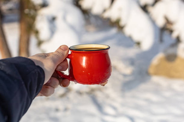 istock Coffee in a cup on the background of a winter theme 1717865709