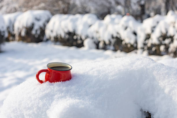 istock Coffee in a cup on the background of a winter theme 1717866222