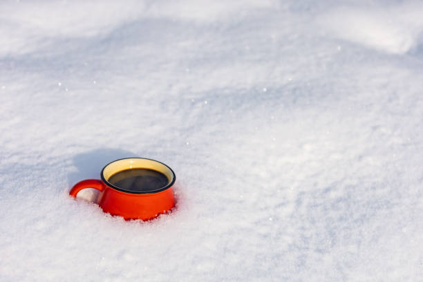 istock Coffee in a cup on the background of a winter theme 1717866744