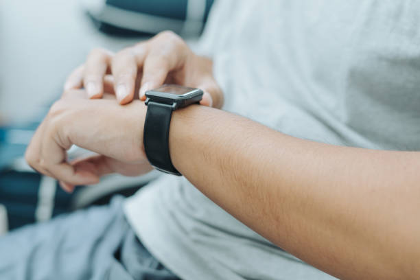 istock Asian man finger hand pressing smart watch buttons and screen 1717874168
