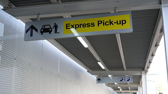 A sign to Expess pick-up area at airport.