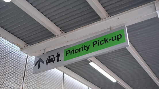 A sign to Priority pick-up area  at airport.