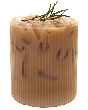 Iced latte in modern glass decorated with a sprig of rosemary and peach on top