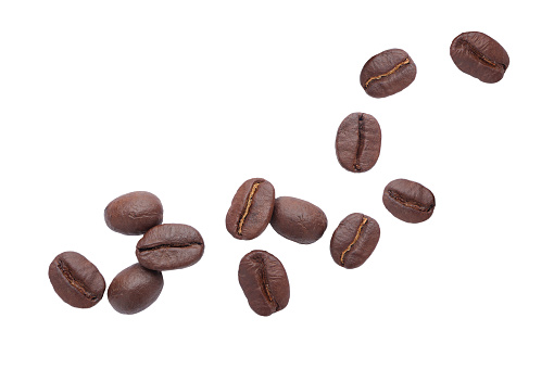 Falling coffee beans isolated on white background with clipping path. Roasted coffee beans