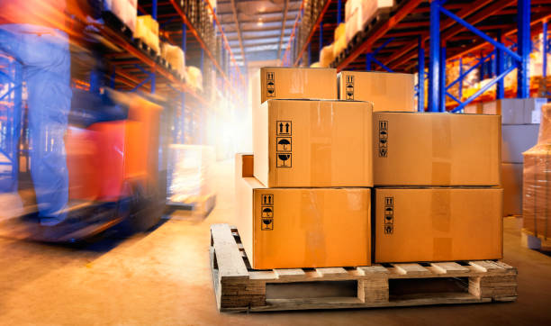 istock Package Boxes Stacked on Wooden Pallets. Cardboard Boxes, Parcels, Forklift Loading in Distribution Storehouse. Shipment Boxes, Supply Chain. Cargo Supplies Warehouse Shipping. 1718010792
