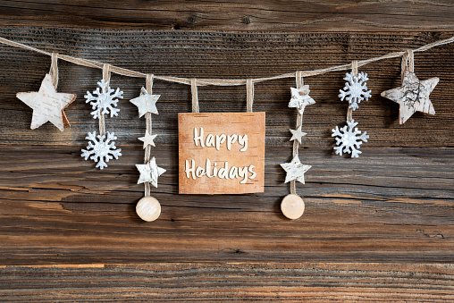 Wooden Background, Natural Christmas Decoration With Wooden Label With Text Happy Holidays