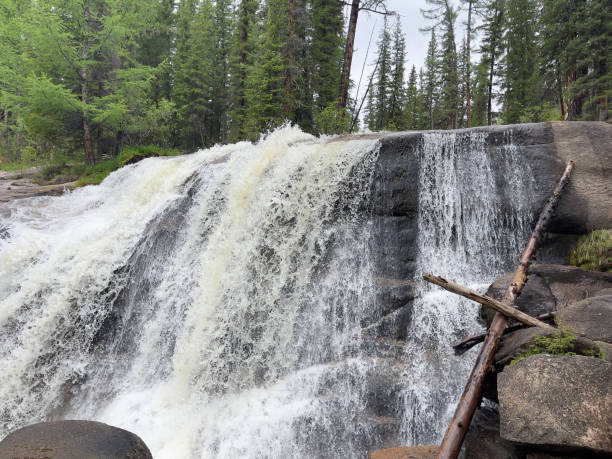 istock A waterfall in a forest in the Altai Mountains. 1718042553