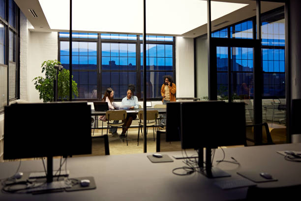 Business people working late in office meeting room