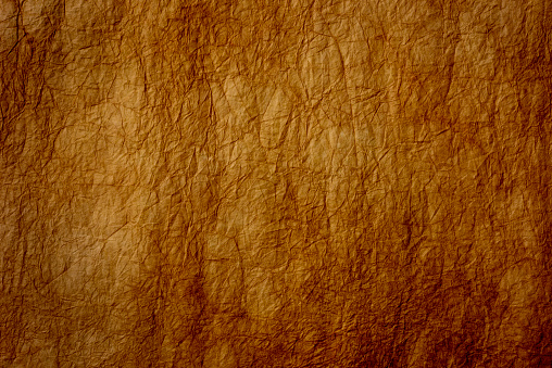 Extreme close-up of abstract brown Washi paper texture background.