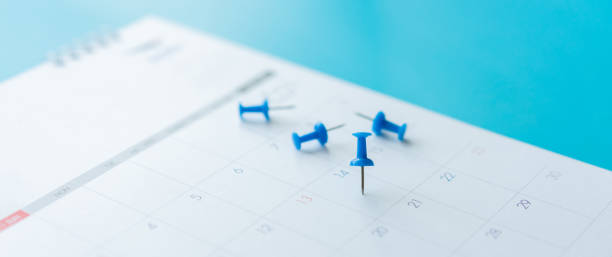 istock close up yellow pushpin on calendar page schedule to make appointment and reminder about holiday weekend concept 1718084838