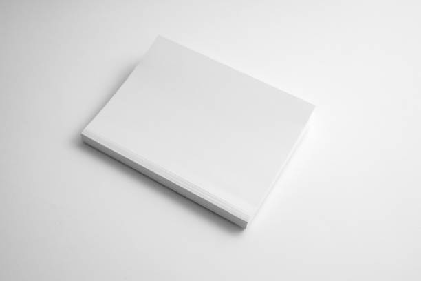 istock Mockup of white book, notebook, copybook, blank notepad cover on white background. Layout mock up ready for your design preview. 1718094605