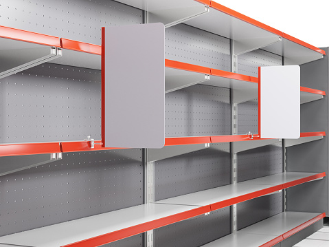 Supermarket shelving with white shelf-stoppers