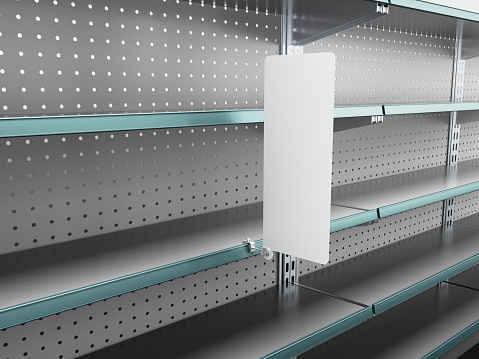 Supermarket shelving with single white shelf-stopper