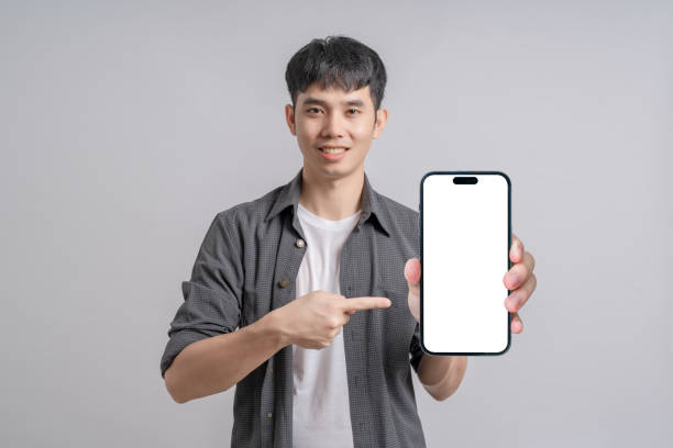istock Handsome man showing smartphone with blank screen. 1718140785