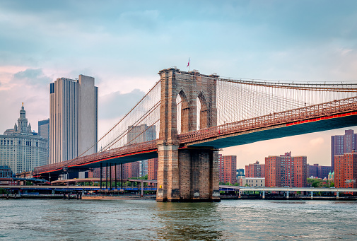 View of Brooklyn Bridge and Lower Manhattan at twilight. New York City. USA