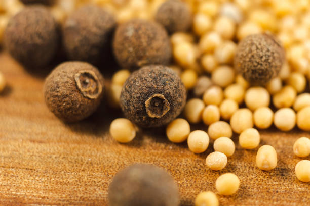 Black pepper with mustard seeds, close-up, macro