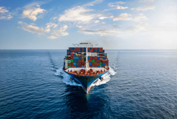 istock Aerial front view of a large container cargo ship over calm sea 1718211835