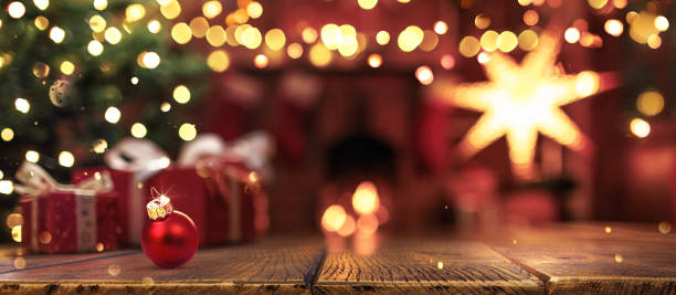 istock Christmas Tree with Decorations Near a Fireplace with Lights 1718250256