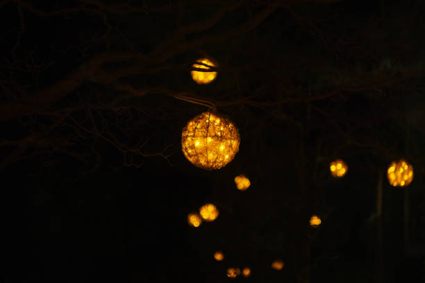 istock Ancient paper lantern with a candle illuminates. Picture for use in illustrations Background image or copy space. 1718256690