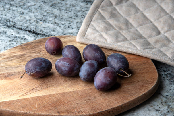 istock Hungarian plums on a cutting board 1718264265