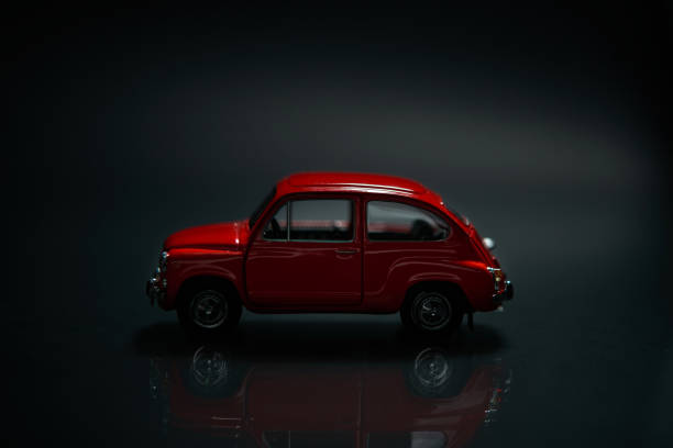 istock Toy red car on the dark background, selective focus. 1718269599