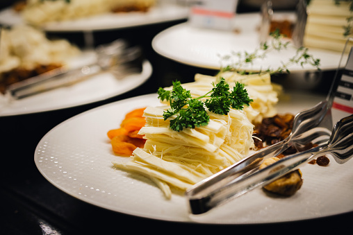Plate with cheese in a restaurant. Food catering.