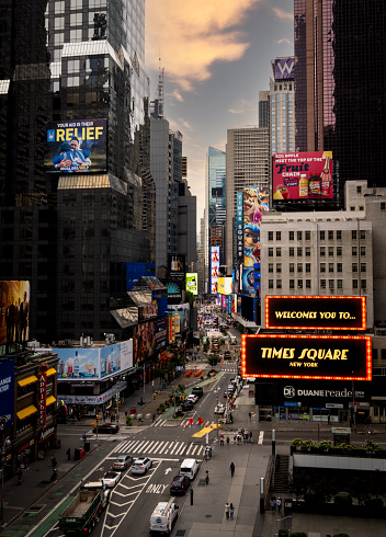 Times Square, New York, USA - September 16, 2023. High angle vertical view of buildings and electronic billboards welcoming people in Times Square New York city with crowds of people and traffic