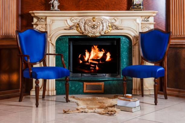 istock Luxury house decoration with blue chairs, red carpet and fire place 1718324583