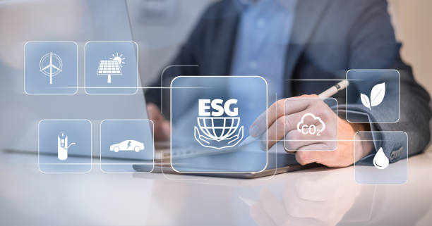 istock Businessman using tablet computer. ESG environmental social governance concept. Business strategy 1718343392