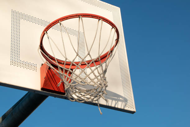 istock Basketball hoop against blue sky 1718345747