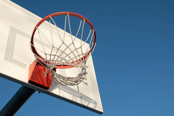 istock Basketball hoop against blue sky 1718346276