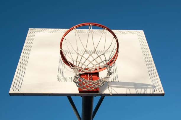 istock Basketball hoop against blue sky 1718346296