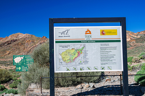 El Teide National Park, Tenerife, Spain;  April 20 2023: Information signs at the foot of the Teide volcano, which indicate the direction for hiking trails
