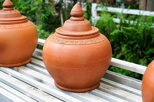 A side view of a drinking jar made from clay for home decoration and drinking water for passersby and tourists.