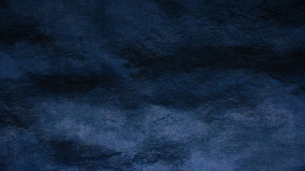 istock Beautiful abstract grungy blue stucco wall background, Beautiful empty stucco wall, Textured rough dark blue surface with space for text. 1718388793