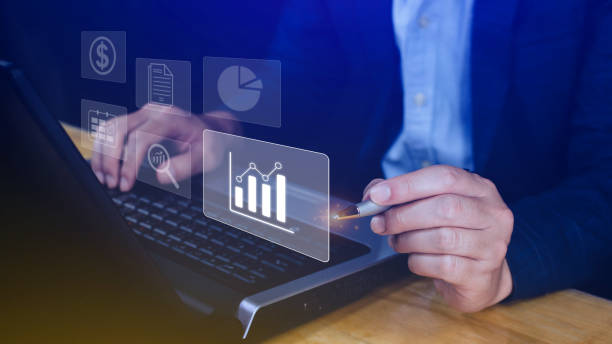 istock Big data analytics and business intelligence BI concept with chart and graph icons on digital screen interface and business people in the background. 1718388798