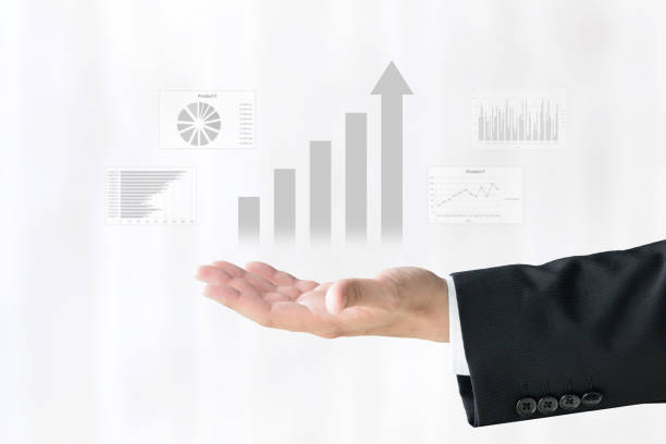 Business man's hand and rising bar graph