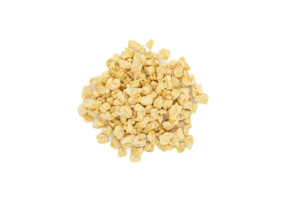 istock Raw dehydrated soy meat or soya textured chunks isolated on white background. Top view 1718406935