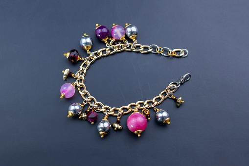 Bracelet of  Morion and Blue Sugilite beads, the power gemstones, close-up shot on white background