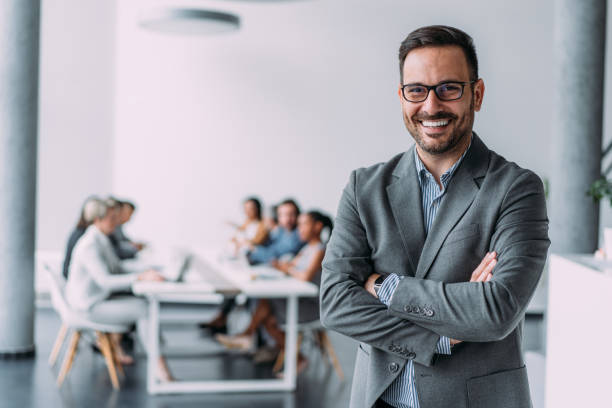 istock Confident businessman and his team. 1718414132