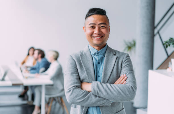 istock Confident businessman and his team. 1718414146