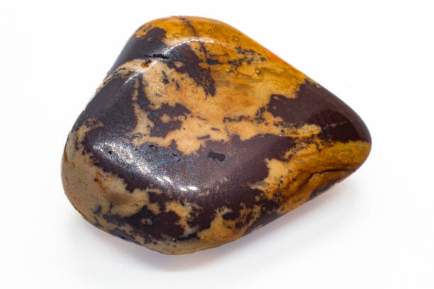 istock Macro focused Polished Brown and beige cappuccino Jasper Chalcedony tumbled crystal stone isolated on a white  surface background 1718416940