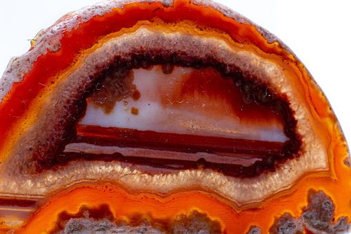White, dark and light orange and red semi-transparent agate slice crystal,
