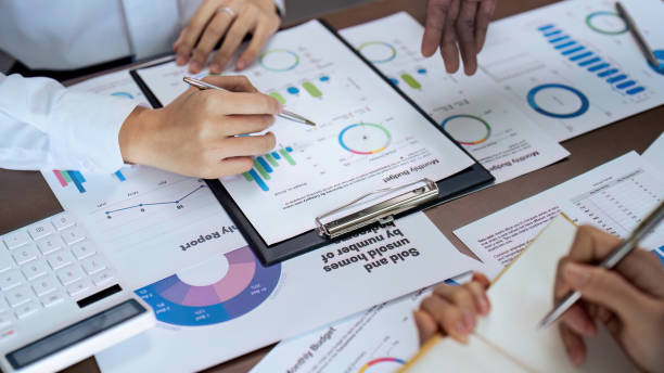 istock Business people teamwork with analysis cost graph on desk at meeting room 1718447918