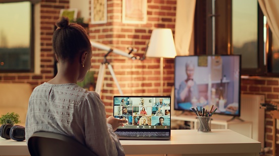 Person attends videocall with people online, discussing about important freelancing tasks to finish in time. Woman meeting with contractor on telework call, remote job at home.