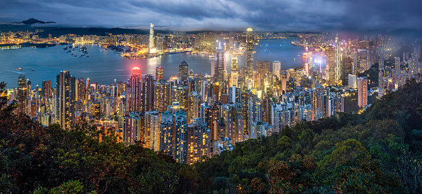 Panoramic aerial view of Hong kong skyline at night from Victoria Peak