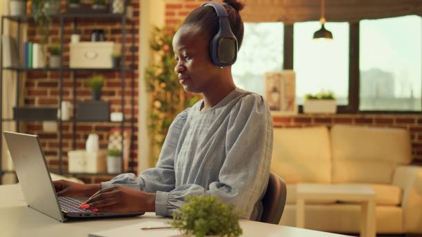 istock Freelancer works at desk with music 1718450730