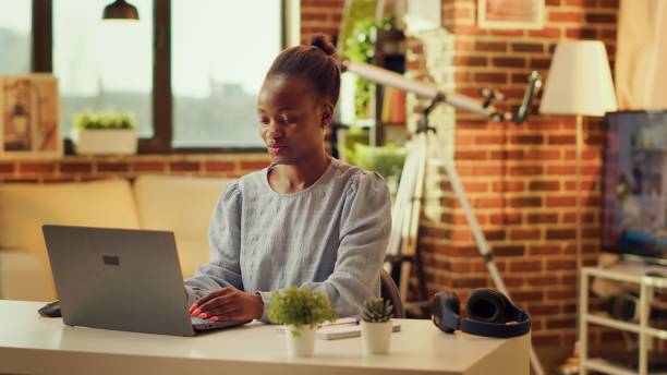 istock African american girl operates from home 1718457529