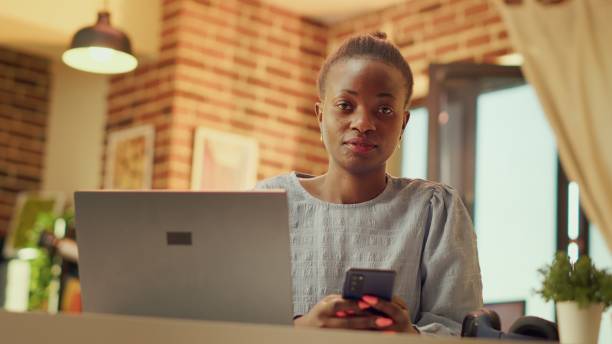 istock African american freelancer uses phone 1718458665